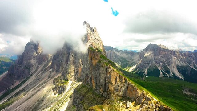 Aerial Panning Scenic Shot Of Clouds On Mountains, Drone Flying Over Landscape - Seceda, Italy