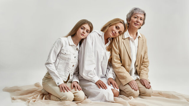 Portrait of three generations of women show support