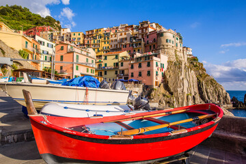 Manarola in the afternoon in August with boats-Liguria-Italy-UNESCO World Heritage Site,