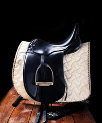 Black professional  leather dressage saddle in complete with nice saddle cloth and girth puted at...