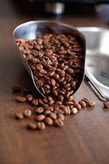 Arabica coffee beans have been roasted on a wooden table in the cafe kitchen