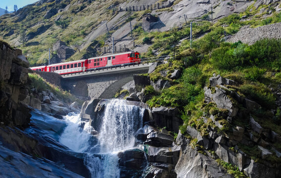 Train of the MGB, Matterhorn Gotthard Bahn, over the Teufelsbr&uuml;cke between Andermatt and G&ouml;schenen in the Swiss canton of Uri.