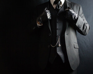 Portrait of Businessman in Dark Suit and Leather Gloves Standing Proudly. Vintage Style and Retro...