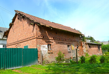 Fototapeta na wymiar Old brick shed of German construction. Slavinsk village, Kaliningrad region