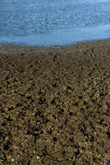Dry and cracked ground caused by drought in Paraiba, Brazil. Climate change and water crisis.