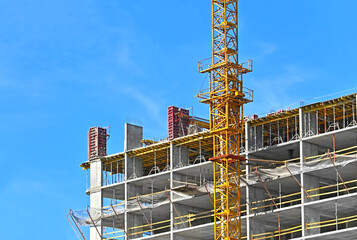 Crane and highrise construction site