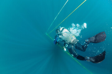 Scuba diver decends on ship wreck, North Carolina, USA