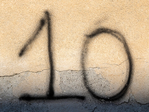 Number 10 on old wall  - Powered by Adobe