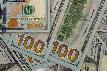 Obraz premium Background with banknotes of american100 dollars bills. Cash money banknotes.