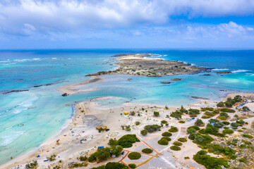 Matala beach with caves on the rocks that were used as a roman cemetery and at the decade of 70's were living hippies from all over the world, Crete, Greece