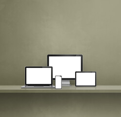 Computer, laptop, mobile phone and digital tablet pc. green shelf background