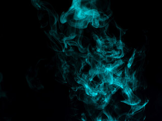 Chaotic mixing smoke creates abstract patterns on a black background