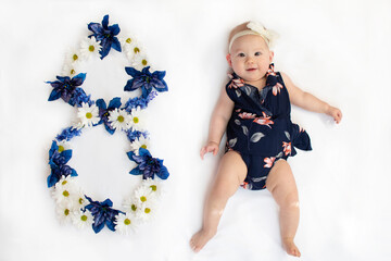Portrait of a girl. Eight-month-old baby girl. 8 months. Birthday. Baby milestones
