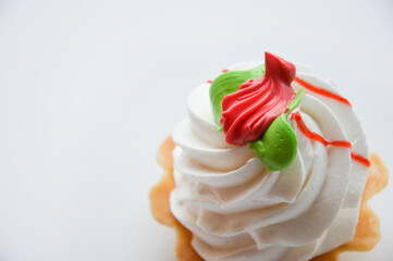 cream cake. dessert with jam and fluffy white cream in a sand basket.