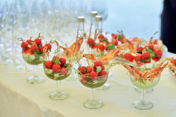 Buffet table with snacks, canape, sandwiches and appetizers at luxury wedding reception outdoors, copy space. Serving food. Catering banquet table