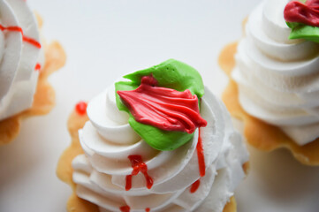 cream cake. dessert with jam and fluffy white cream in a sand basket.
