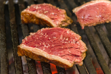 Barbecue sliced steak roasting on the coals. This form of barbecue is widely consumed throughout Brazil.
