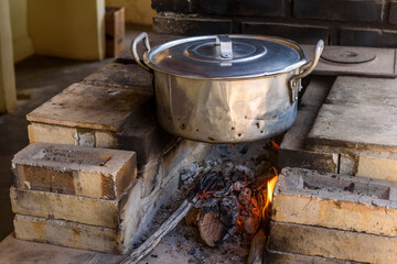 Wood stove with aluminum pan.