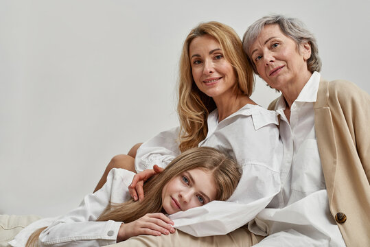 Family portrait of happy three generations of Caucasian women