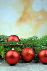 Christmas background with spruce branches, red balls and ornaments