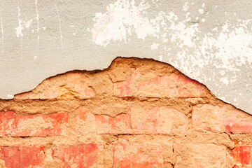 Texture of a brick wall with cracks and scratches which can be used as a background
