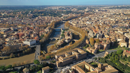 Aerial drone photo of Tiber island or Isola Tiberina, a small island in a bend of the River Tiber with a number of historical buildings and monuments, Rome historic centre, Italy - obrazy, fototapety, plakaty