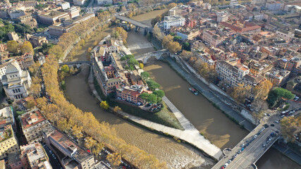 Aerial drone photo of Tiber island or Isola Tiberina, a small island in a bend of the River Tiber...