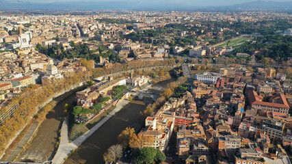 Aerial drone photo of Tiber island or Isola Tiberina, a small island in a bend of the River Tiber with a number of historical buildings and monuments, Rome historic centre, Italy