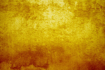 abstract background texture of aged, bright, grunge wall with structure in golden, orange or autumn color feel.