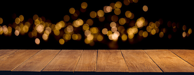 Oak plank podium or table on a black background with bokeh lights