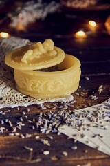 A small handmade beeswax box with lavender flowers .