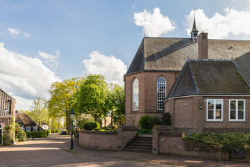 View of the old church and houses in the center of the Dutch village Soest.