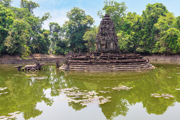Ruins of Neak Pean temple at Angkor, Cambodia. Artifactually island and Central pond at Wat Prasat...