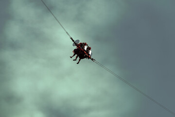 People have extreme rest. Swing at high altitude in the clouds.