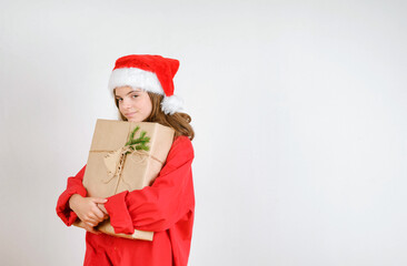 Girl in Santa's hat with present