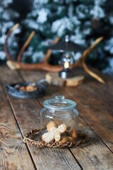 Decoration of a New Year's or Christmas table. Festive tableware and food style. Various decorative elements