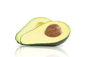 Two halves of avocado with seed.