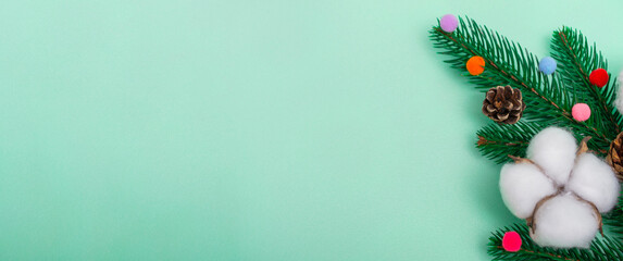New Year's layout. Natural Christmas decorations on a mint background.  copy space, close up