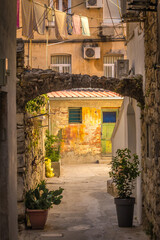 Fototapeta na wymiar A narrow street with hanging laundry in the historic center of Split town, Croatia, Europe.