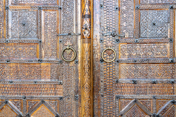 Uzbekistan, beautiful old carved wooden door.
