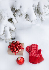 Gifts in the snow under a Christmas tree in the forest on the nature