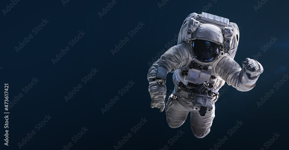 Poster Astronaut floating and isolated on dark background. Spaceman sci-fi space wallpaper. Elements of this image furnished by NASA
