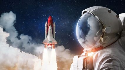 Astronaut and Space Shuttle rocket launch in the sky with clouds. Outer space with stars and spaceship. Sci-fi fantasy collage. Elements of this image furnished by NASA