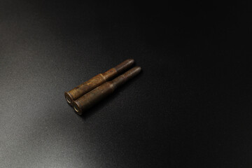 Vintage cartridge for Russian rifle on black background