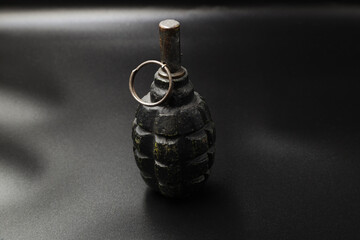 Obraz premium Rusty russian grenade of the second world war on black background