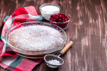 Swedish saffron Kladdkaka, pie with white chocolate, whipping cream and cranberry, horizontal