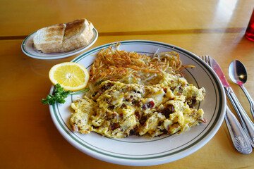 Hearty bacon and egg scramble with hashbrowns and toast