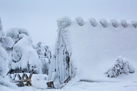 A Wood Shed in Finnish Lapland covered in snow after a blizzard. Chocolate Box Winter Scene
