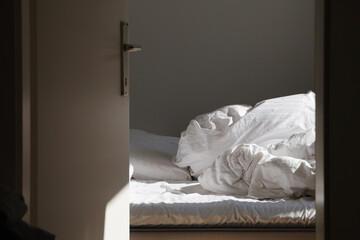 Empty unmade bed in the morning	
