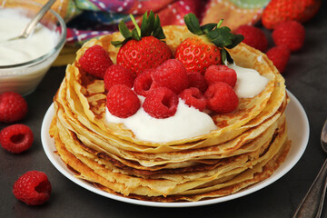 Russian cuisine national dish bliny with fresh berries	
